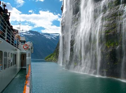 Fjordcruise On Geirangerfjorden Passing Brudesløret Waterfall